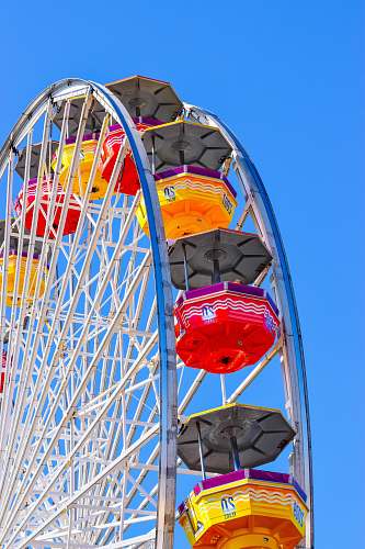 ferris wheel photo of a Ferris wheel under blue skies leisure activities